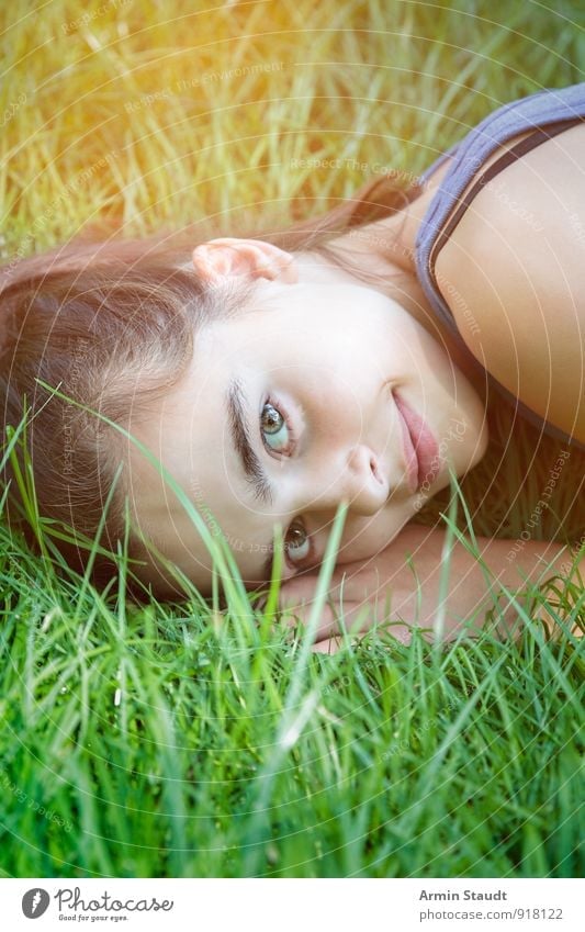 Smile in the grass Lifestyle Healthy Relaxation Summer Human being Woman Adults Youth (Young adults) 1 13 - 18 years Child Nature Spring Grass Meadow Smiling