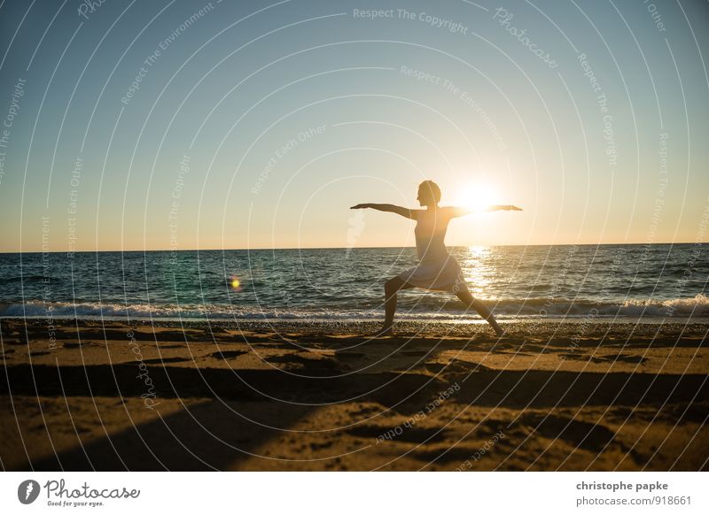 Woman doing yoga on the beach in the evening sunset Athletic Fitness Life Harmonious Well-being Relaxation Meditation Vacation & Travel Summer Summer vacation