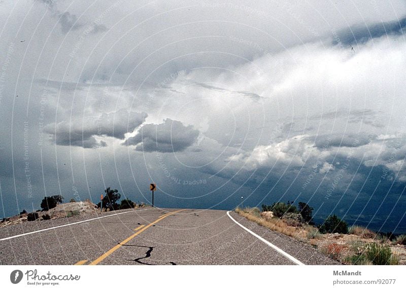 Road to nowhere Gale Clouds California In transit Ambiguous Clear Traffic infrastructure Sky USA Thunder and lightning Rain Street road layout away into nowhere