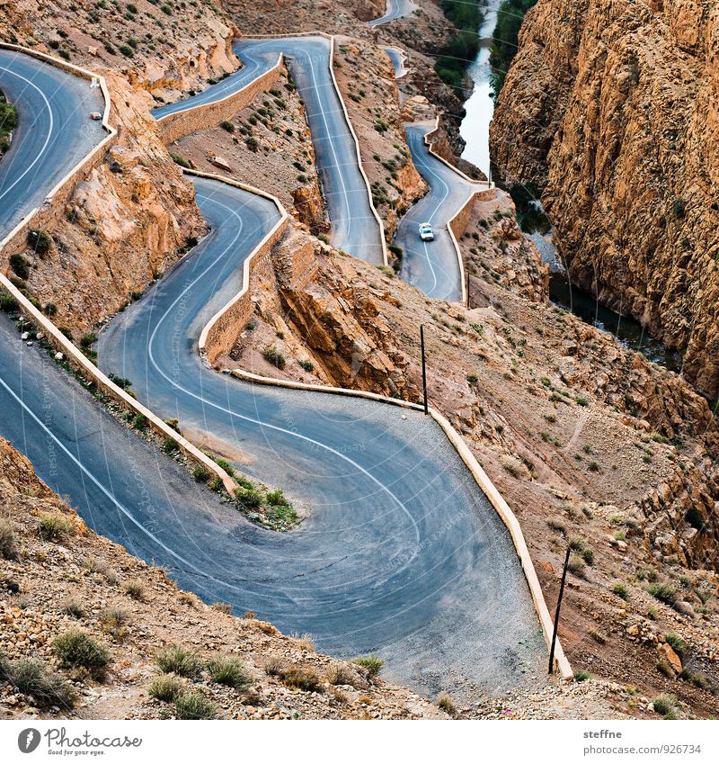 away downwards Nature Landscape Mountain Canyon Traffic infrastructure Motoring Street Blue Brown Winding road Dangerous Morocco dades gorges du dades Atlas