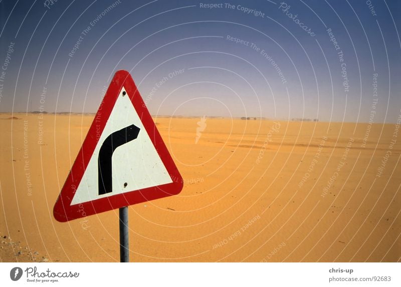 Right turn in desert Scrap metal Scrapyard Loneliness Abu Simbel Egypt Assuan Badlands Physics Africa Drought Street sign Curve Dangerous Navigation Road maps