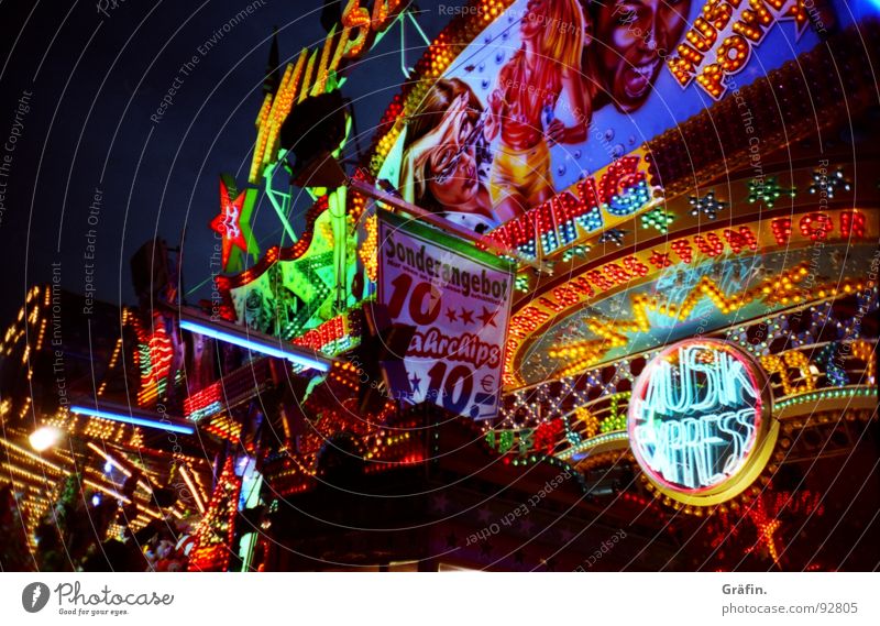 Colourful diversity Shooting match Fairs & Carnivals Summer July Hannover Light Night Multicoloured Electric bulb Glittering Lottery booth Theme-park rides