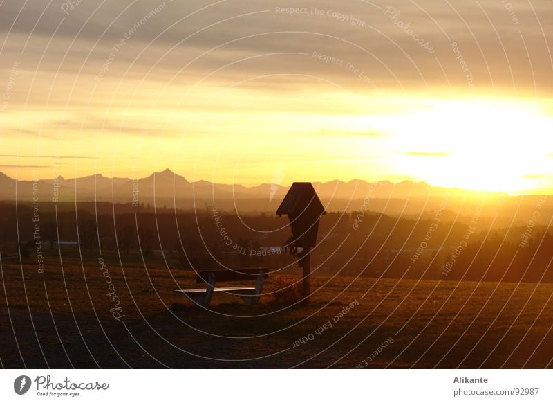 Sun goes Sunset Physics Yellow Red Roadside calvery Allgäu Twilight Sunbeam Grief Memory Mountain range Longing Homesickness Calm Warmth Back Bench Alps Heimal