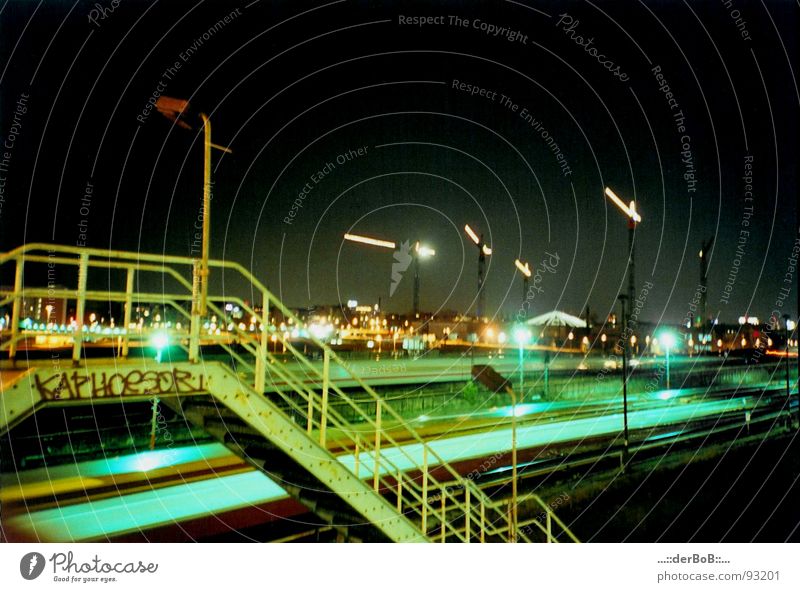 KAPHOeSOR Germany Warschauer Bridge Railroad Crane Railroad tracks Night Lantern Green Yellow Analog Lomography Long exposure Capital city Berlin Handrail