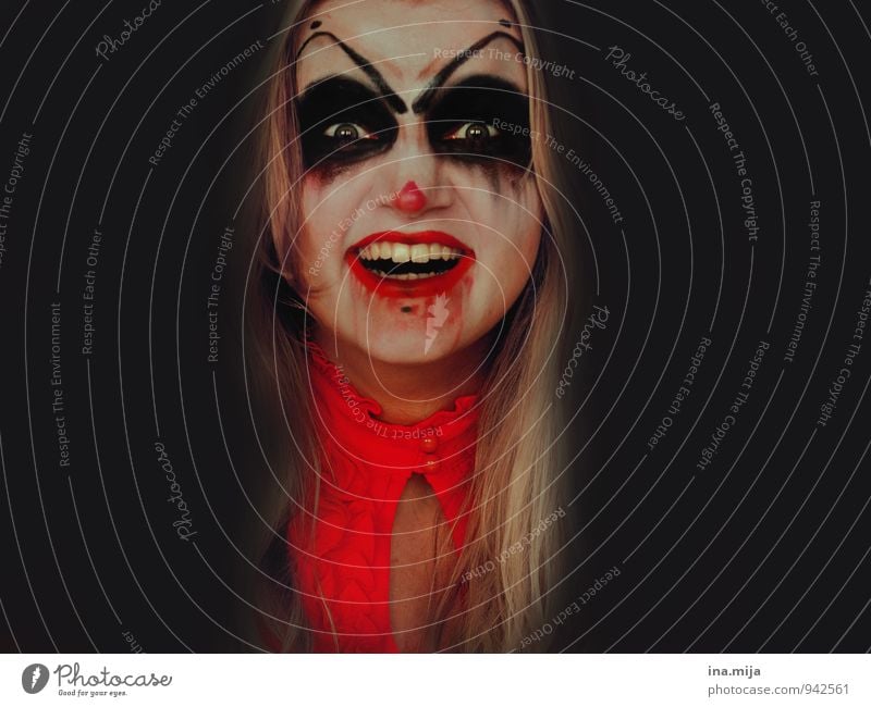 creepy young laughing woman made up as horror clown Feasts & Celebrations Carnival Hallowe'en Human being Feminine Face 1 Anger Red Black Emotions Moody