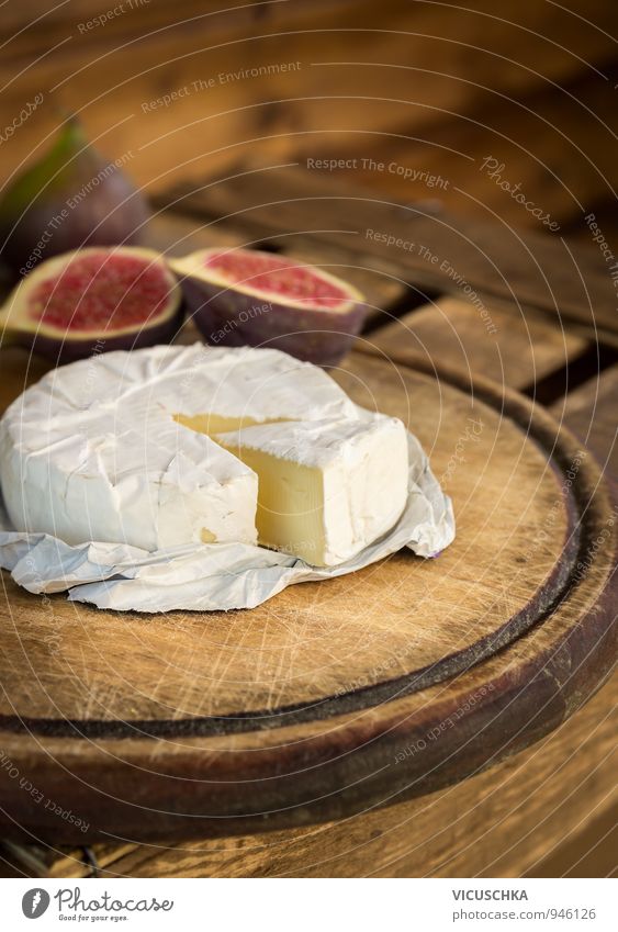 Camembert on old wooden board Food Cheese Fruit Dessert Nutrition Eating Breakfast Organic produce Vegetarian diet Healthy Eating Soft Brown Yellow White