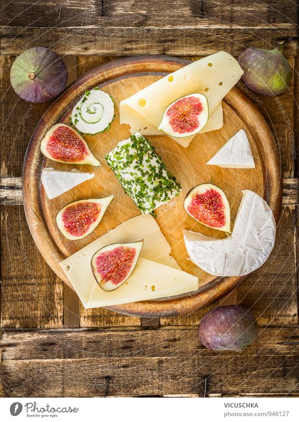Round cutting board with cheese and figs Food Cheese Fruit Nutrition Breakfast Lunch Buffet Brunch Banquet Picnic Organic produce Vegetarian diet Diet Lifestyle