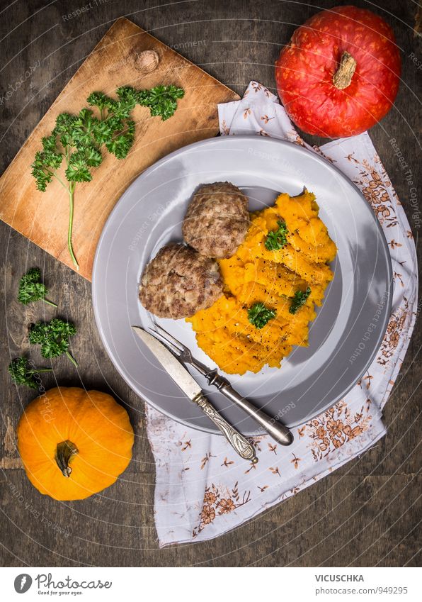 Pumpkin puree with meat meatballs. Food Meat Vegetable Nutrition Lunch Dinner Banquet Organic produce Diet Crockery Plate Cutlery Knives Fork Healthy Eating