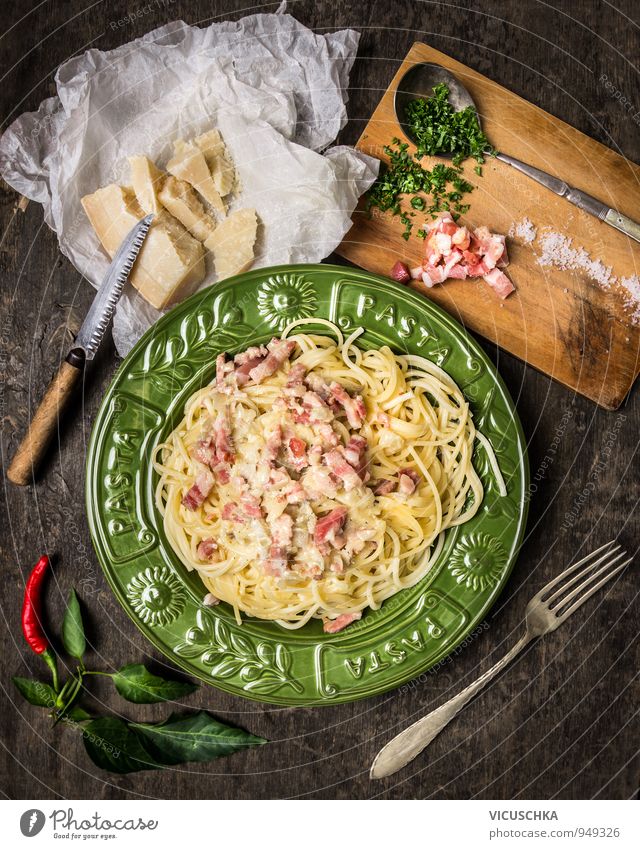 Pasta Carbonara and ingredients. Food Sausage Cheese Vegetable Herbs and spices Nutrition Lunch Dinner Banquet Organic produce Diet Italian Food Plate Knives