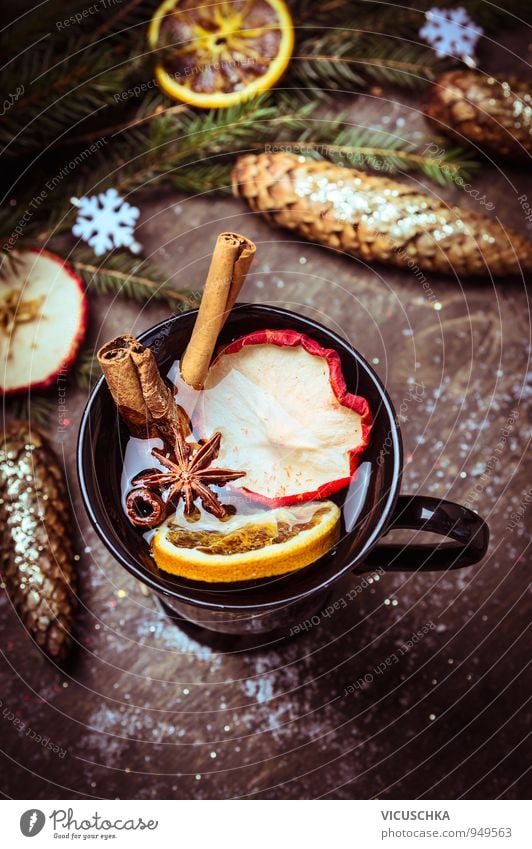 Mulled wine with dried fruits on winter decoration Food Fruit Apple Orange Herbs and spices Banquet Beverage Hot drink Tea Alcoholic drinks Wine Cup Lifestyle