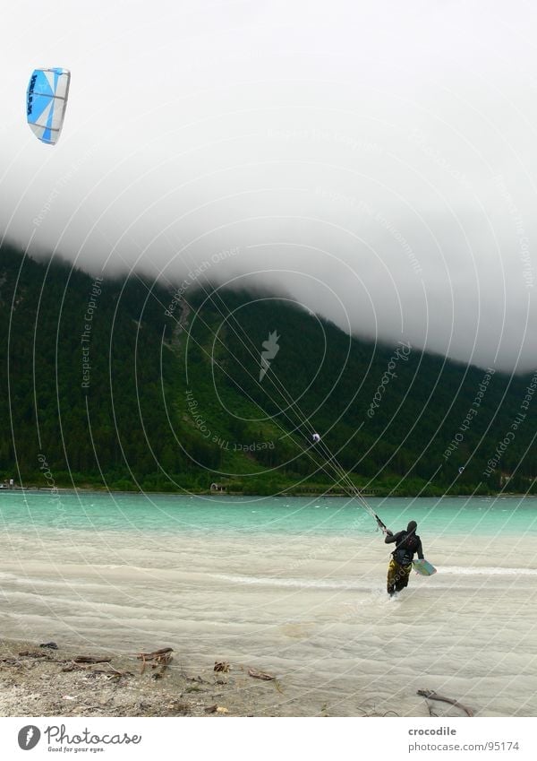 skystormer Kiter Surfer Lake Lake Achensee Federal State of Tyrol Cold Wind Clouds Passion Dark Beach String Forest Sports Dangerous Extreme sports kitesurfer
