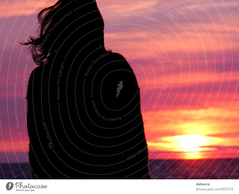 Silhouette of young woman standing on the beach with a pink sunset in the background. Romance Red Violet Sunset Ocean Clouds Woman Black Beach Summer Orange Sky