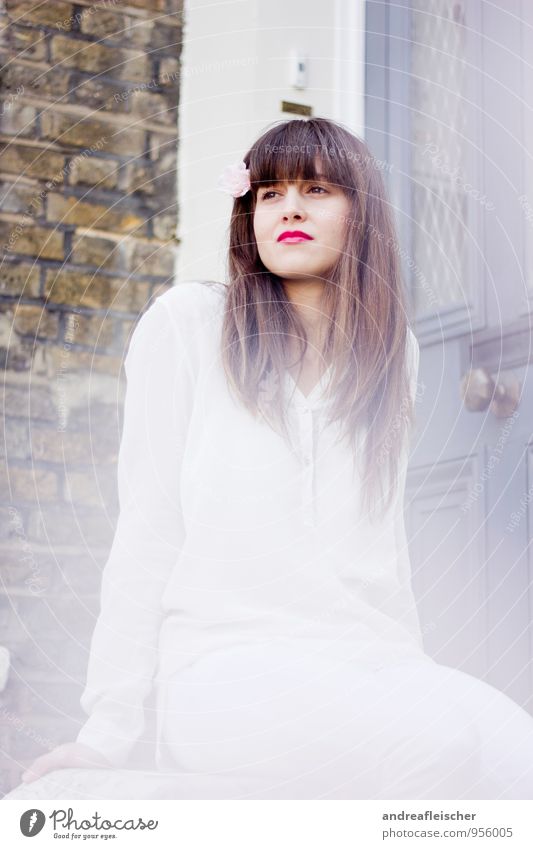 Flower Girl of London. Feminine Young woman Youth (Young adults) 1 Human being 18 - 30 years Adults Shirt Pants Brunette Long-haired Bangs Sit Brick wall