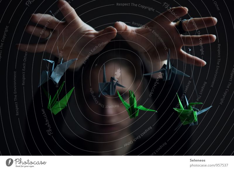 Concept of control. Marionette in human hand. Stock Photo