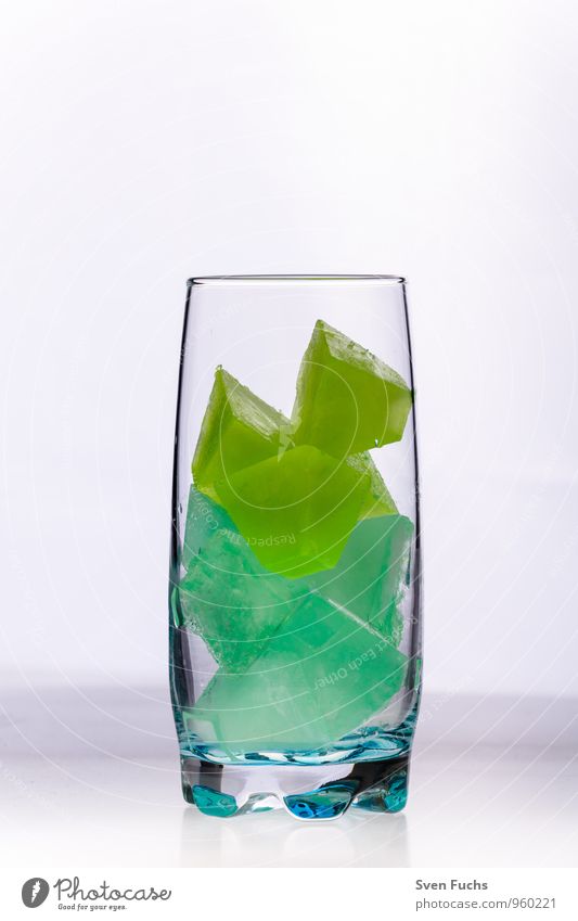 Ice in a glass Longdrink Cocktail Glass Cold Yellow Green Ice cube Frozen lime Mint Cube Multicoloured Close-up