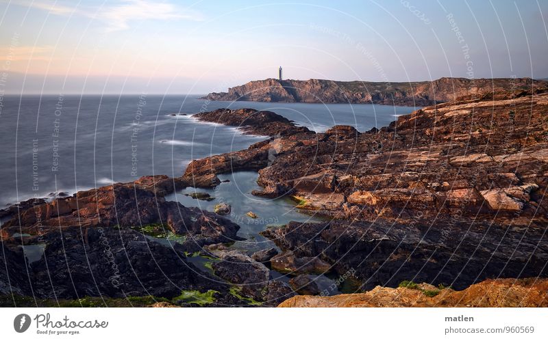 lighthouse Nature Landscape Sky Clouds Horizon Sunrise Sunset Weather Beautiful weather Rock Waves Coast Reef Ocean Lighthouse Blue Brown fissured Peninsula