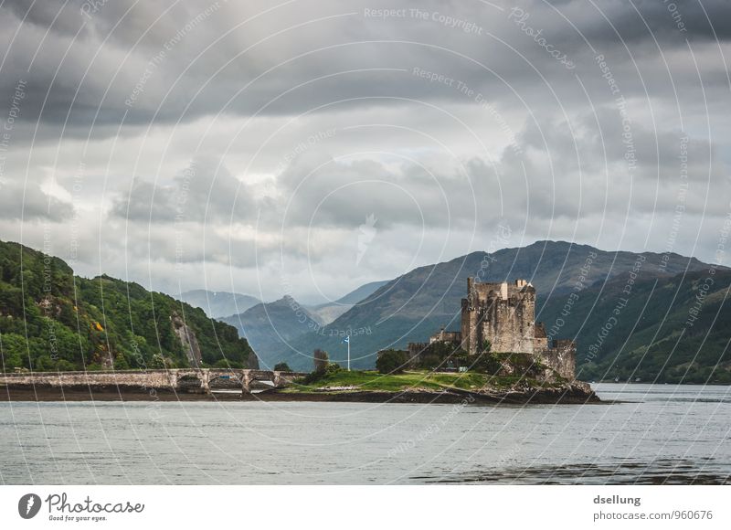 Eilean Donan Castle Environment Nature Landscape Sky Clouds Spring Bad weather Hill Coast Lakeside Manmade structures Building Tourist Attraction Old Famousness