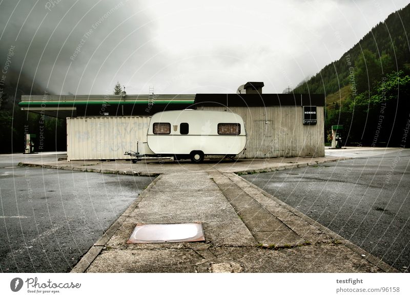 caravans Vacation & Travel Bad weather Damp Wet Cold Petrol station Parking lot Break Hold Mountain Clouds Rain cloudy mountains