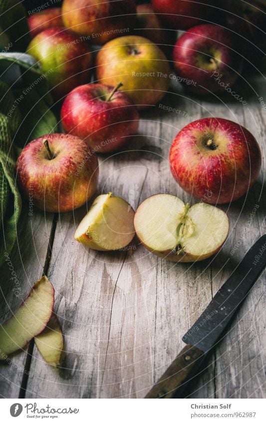 Natural organic Elstar apples on wooden background with cut apple in foreground Food Fruit Apple Apple skin Organic produce Healthy Eating naturally Red