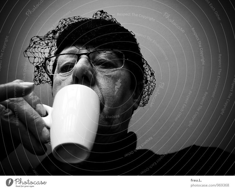 at the edge of the coffee cup Beverage Espresso Cup Restaurant Human being Woman Adults Female senior Head Hand 1 45 - 60 years Eyeglasses Hat Drinking Old