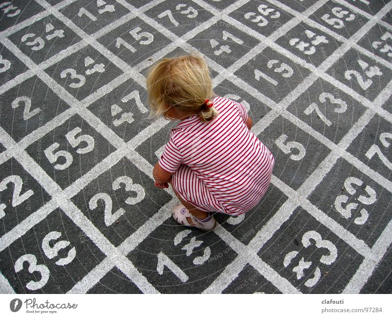 (7*5)+11-4=? Colour photo Exterior shot Day Bird's-eye view Playing Child Girl Dress Digits and numbers Crouch Infancy Asphalt Calculation Mathematics