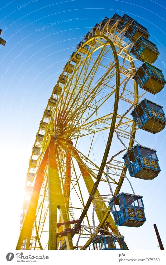 Ferris wheel in the sun Fairs & Carnivals Sun To swing Free Tall Above Blue Yellow Colour photo Multicoloured Exterior shot Copy Space left Day Light Sunlight