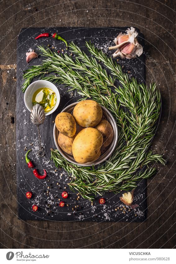 Ingredients for rosemary potatoes with spices and oil Food Vegetable Herbs and spices Cooking oil Nutrition Banquet Organic produce Vegetarian diet Diet Style