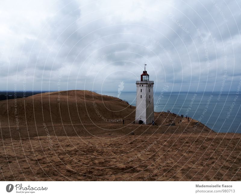 Lighthouse on shifting sand dune at the sea Ocean coast Vacation & Travel Adventure Far-off places Freedom Nature Landscape Sand Water Clouds Ruin
