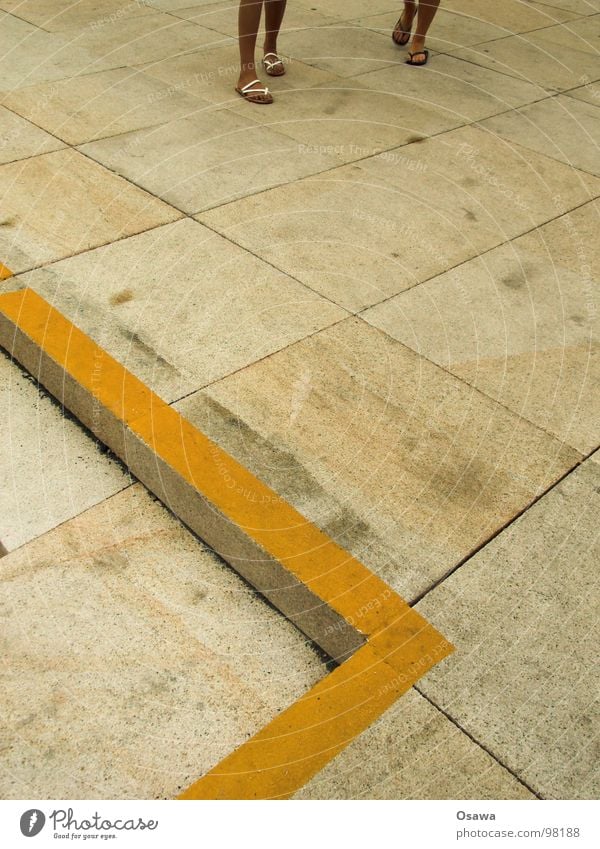 with flip flops around the corner Concrete Stone slab Floor covering Yellow Flip-flops Summer Beige Gray Traffic infrastructure Tile Stairs Corner Line
