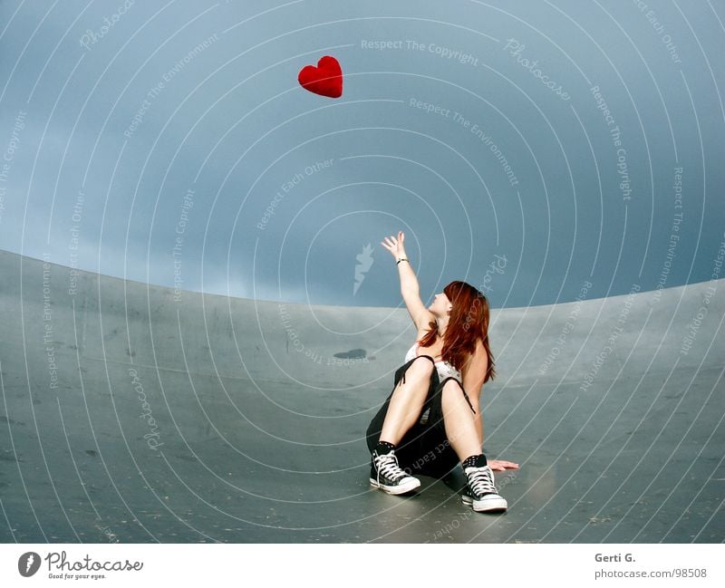 take heart... Woman Young woman Catch Touch Bad weather Clouds Location Satellite dish Footwear Chucks Gray Red Flying Symbols and metaphors Cushion Heart
