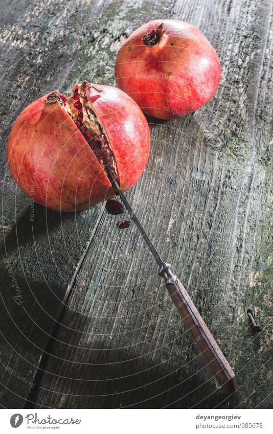 Pomegranate on wooden table Fruit Eating Vegetarian diet Juice Table Nature Fresh Juicy Red Colour knife ripe background Organic healthy sweet Raw food seed