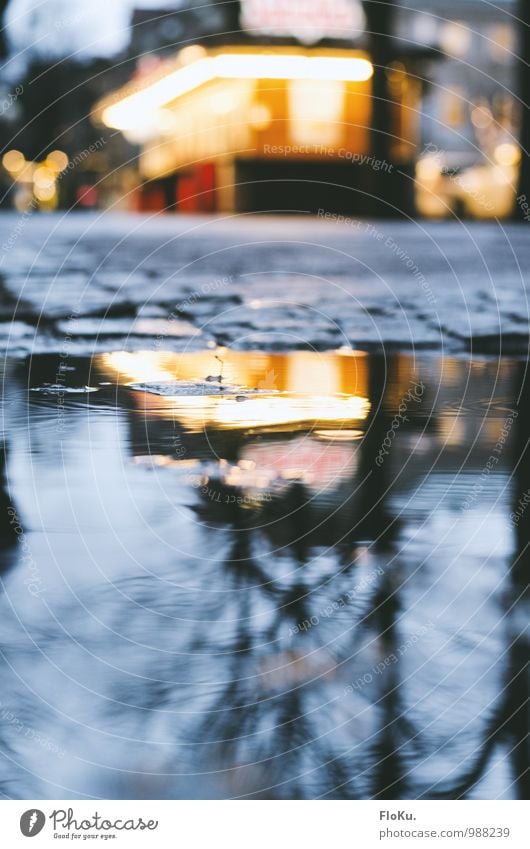 Snack in the puddle Water Autumn Winter Bad weather Rain Göteborg Town Downtown Deserted Hut Traffic infrastructure Street Lanes & trails Wet Blue Yellow