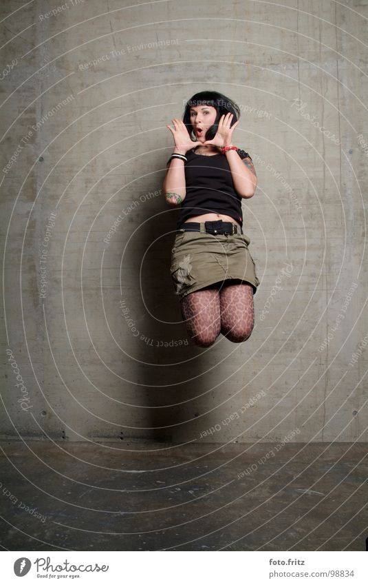 jump Woman Youth (Young adults) Jump Far-off places Beautiful Interesting Concrete Wall (building) Surprise Scream Air Stockings Aggravation Portrait photograph