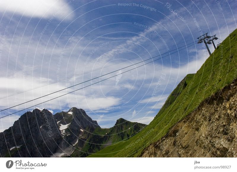 Summer break III Chair lift Wire 3 Slope Grass Clouds Bad weather Steep Dismantling Rope Mountain Tall Above Upward Electricity pylon Sky Rock Ski run