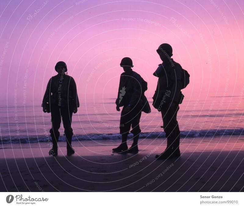 D-Day Landing Adventure Sun Beach Ocean Waves Human being Masculine Man Adults 3 Water Sky Horizon Sunrise Sunset Coast Boots Helmet Bizarre Normandie