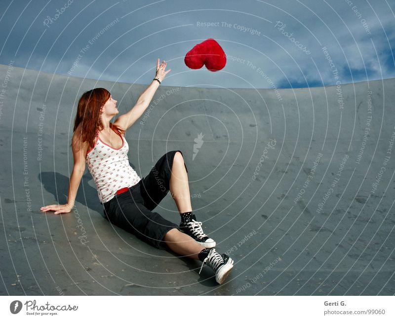 heart's desire Woman Young woman Catch Touch Bad weather Clouds Location Footwear Chucks Gray Red Flying Hover Symbols and metaphors Cushion Heart Decoration