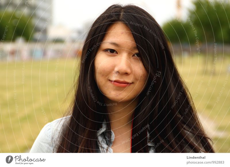 Berlin Portrait F#1 Hair and hairstyles Face Woman Adults Lips Meadow Black-haired Green Red Asians Downtown Berlin Smiling Laughter Colour photo Exterior shot