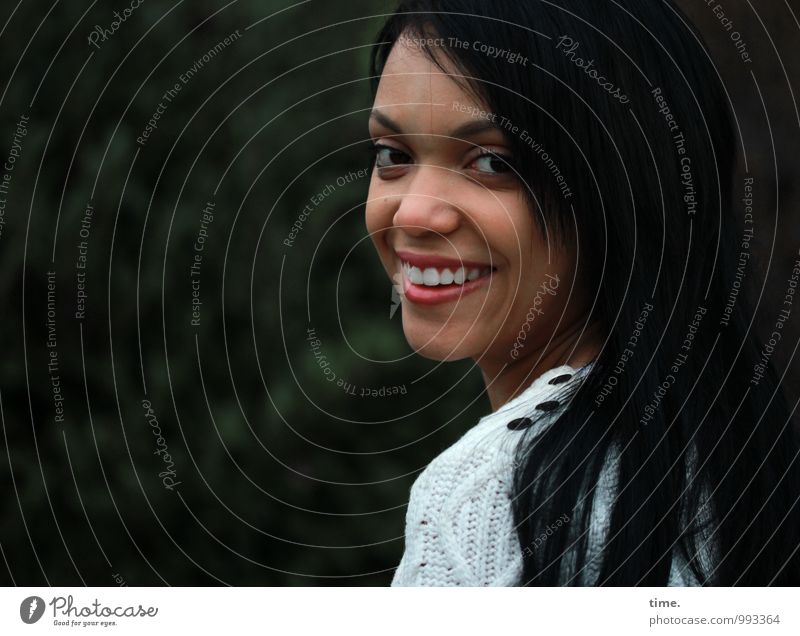 . Feminine Young woman Youth (Young adults) 1 Human being Bushes Park Sweater Black-haired Long-haired Observe Smiling Laughter Looking Wait Beautiful Joy Happy